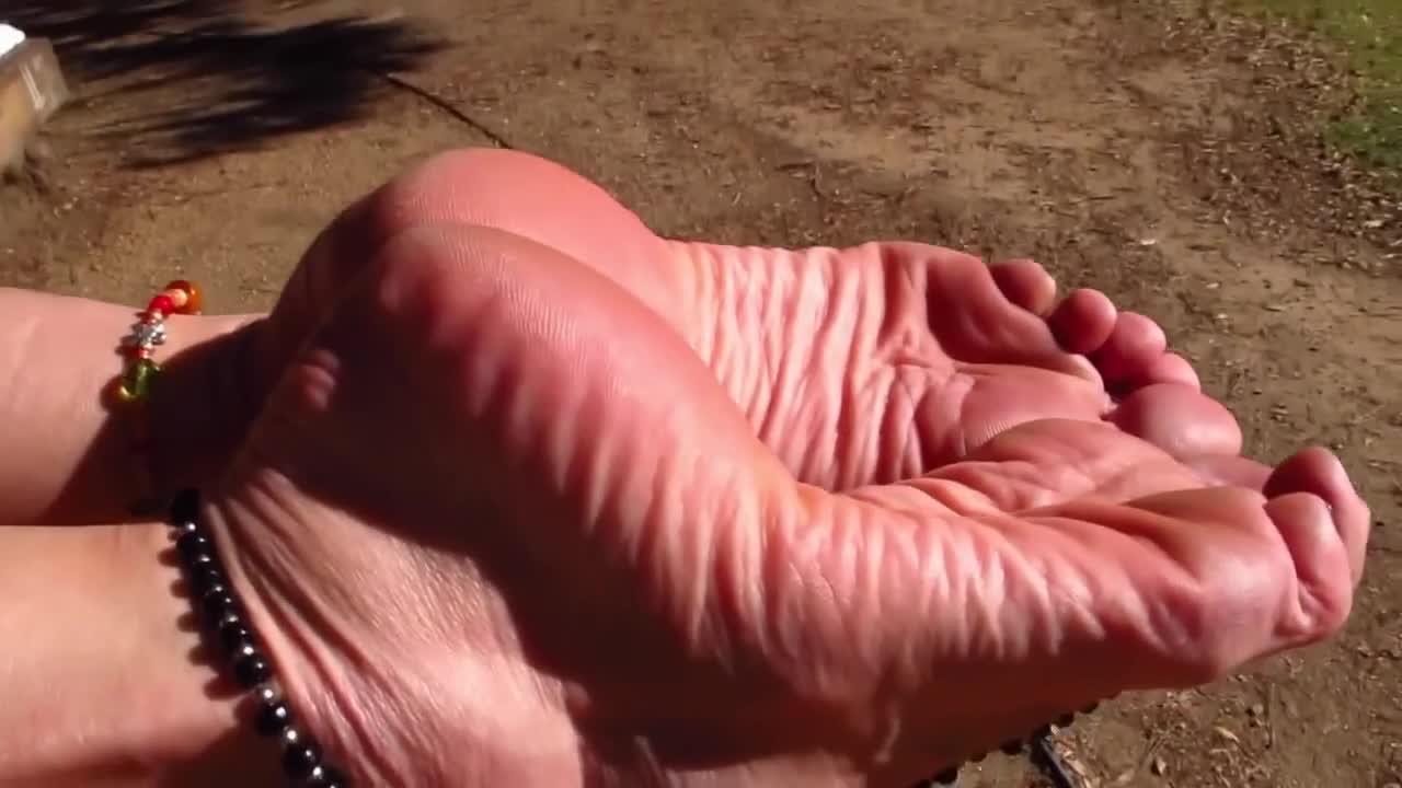 Stunning MILF exposing her beautiful sensitive soles outdoors close up -  Feet9